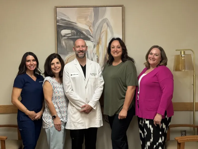 Dr. Colton McNichols with the practice team
